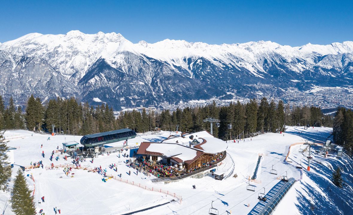 Muttereralm in Austria: a ski resort surrounded by snow covered mountains.