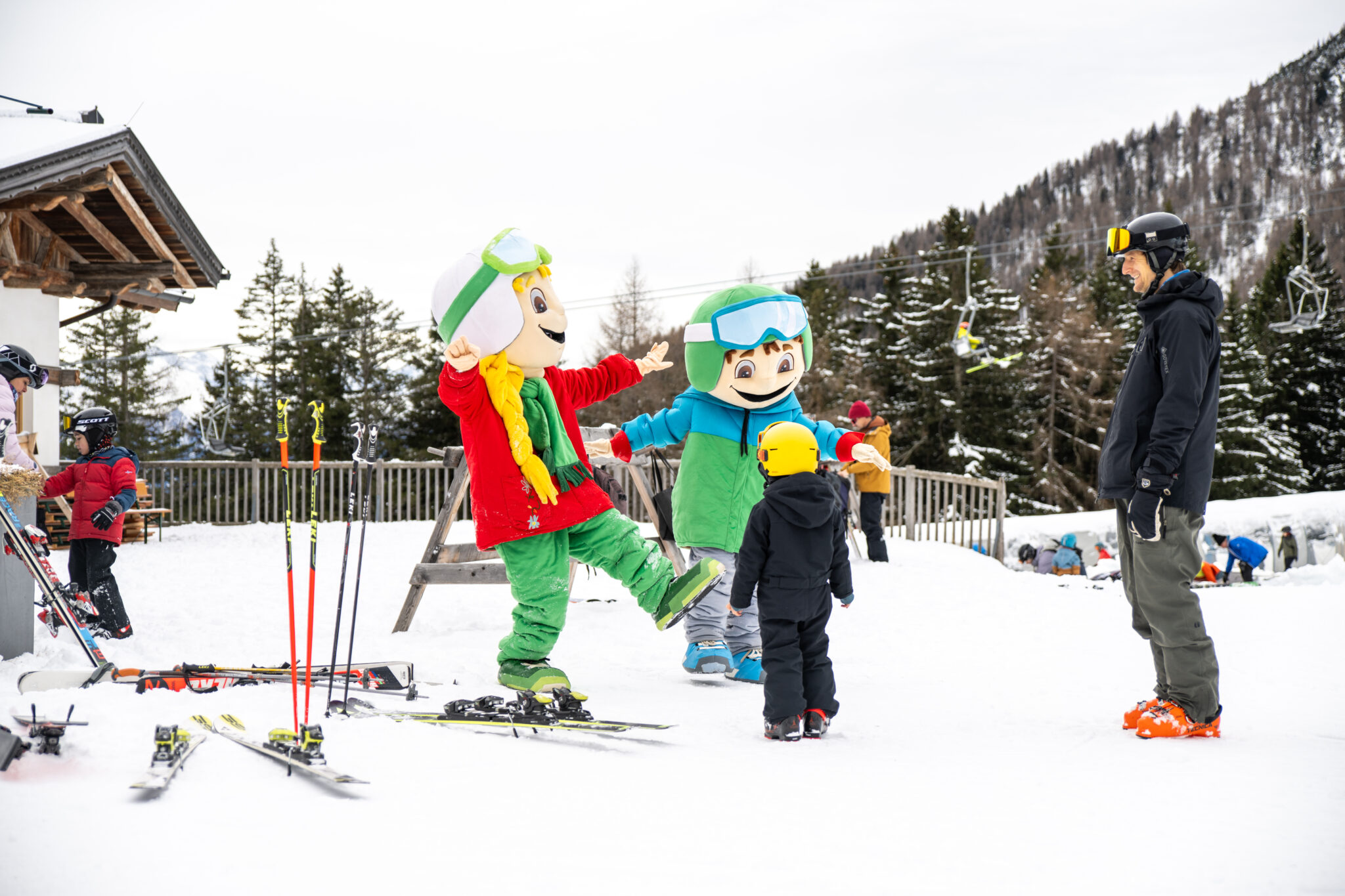Muttereralm in Austria - a group of people standing on top of a snow covered slope.