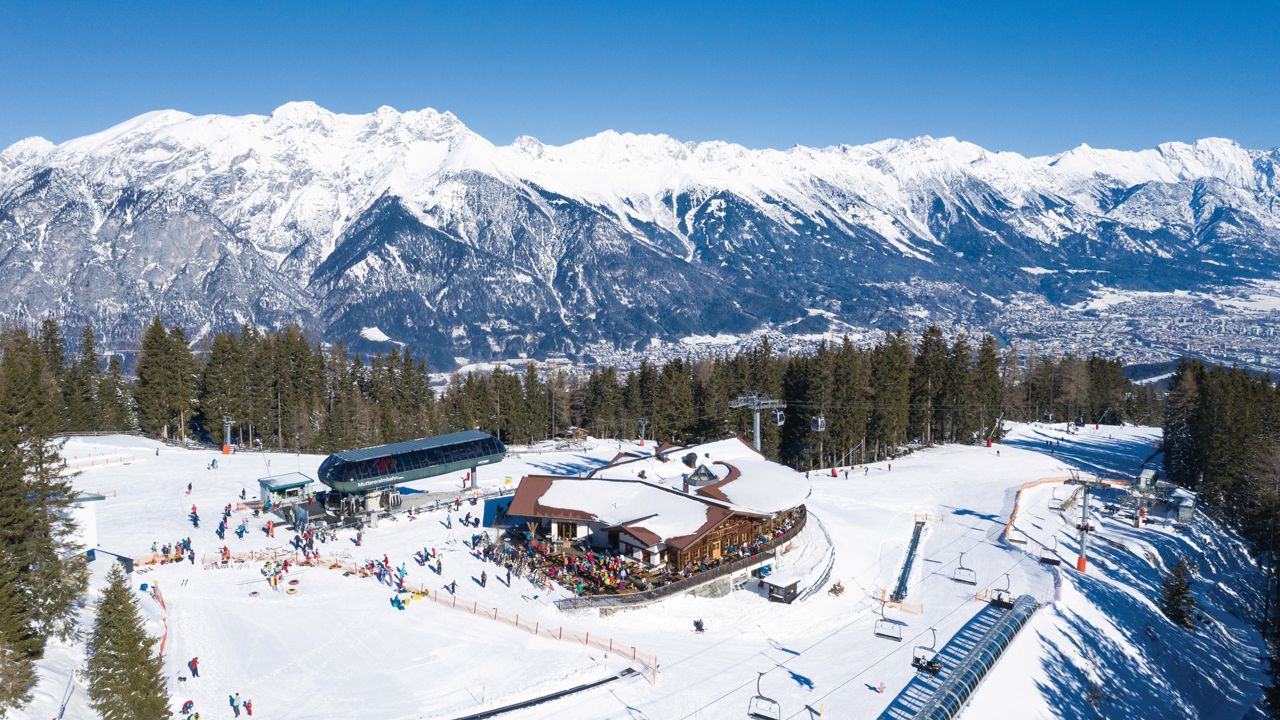 Muttereralm in Austria: a ski resort surrounded by snow covered mountains.