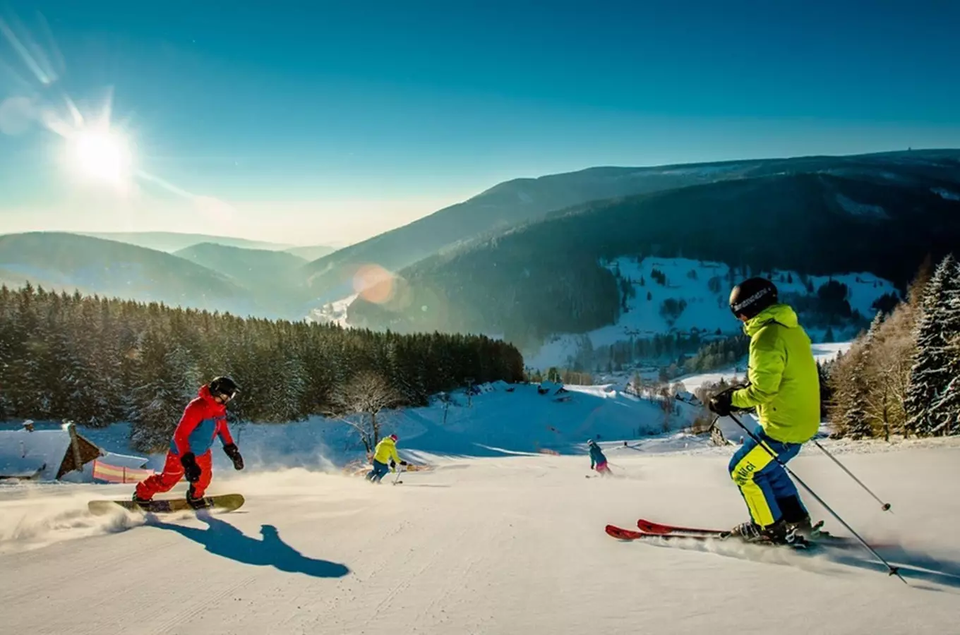Pradědova aréna in Czech Republic - a group of people skiing down a mountain.