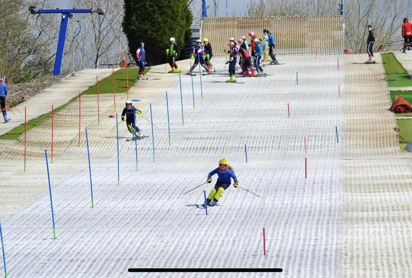 Stoke Ski Centre in United Kingdom - a group of people skiing down a slope.