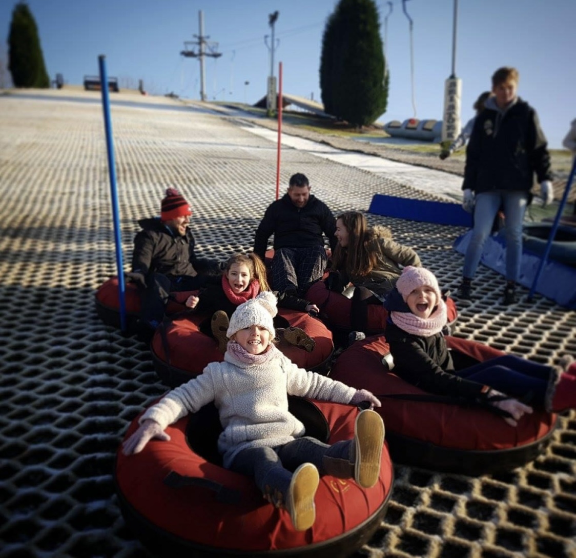 Stoke Ski Centre in United Kingdom - a group of people sitting on top of a red couch.