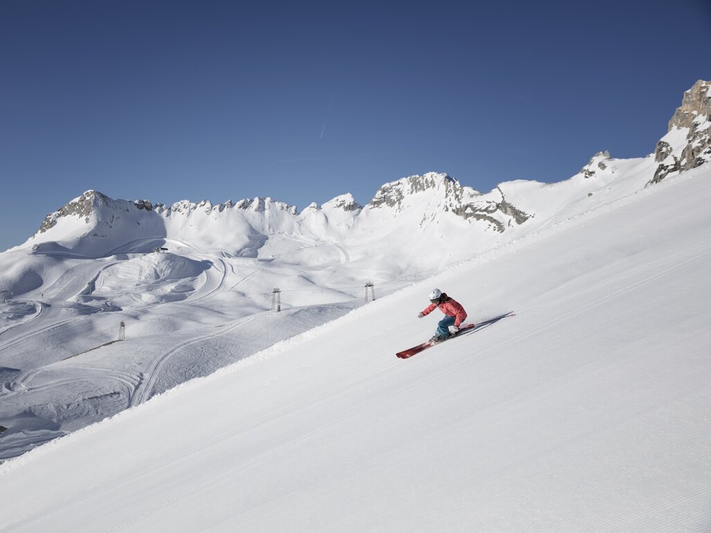 Zugspitze in Germany - a person skiing down a snow covered mountain.