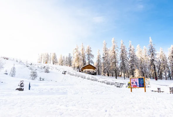 Valberg | Beuil les Launes in France - a snow covered ski slope with trees in the background.