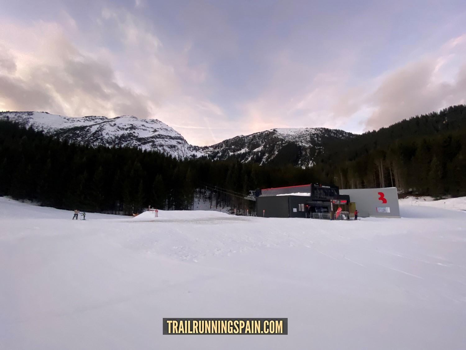 Skiarena Berwang in Austria - a snow covered ski slope with mountains in the background.