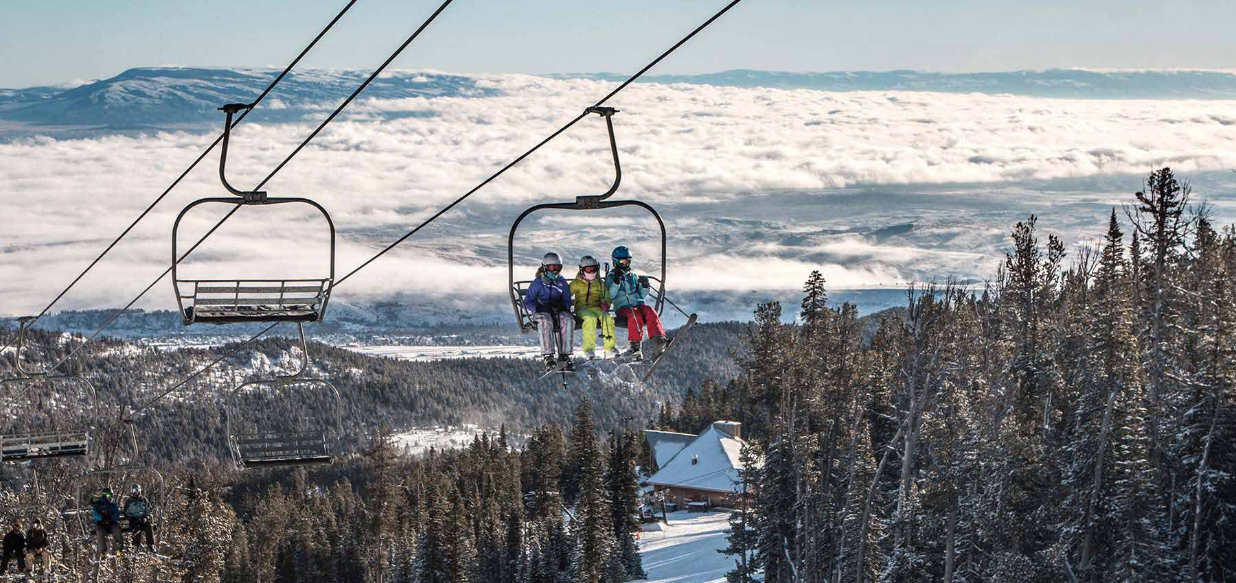Red Lodge Mountain in USA - two people on a ski lift in the mountains.