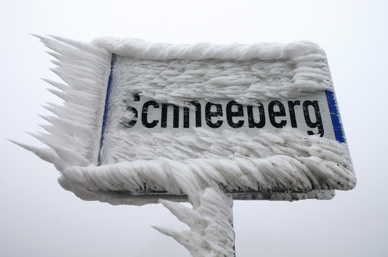 Hoher Meissner – Eschwege | ​Hessisch Lichtenau in Germany - a sign that is covered in ice.