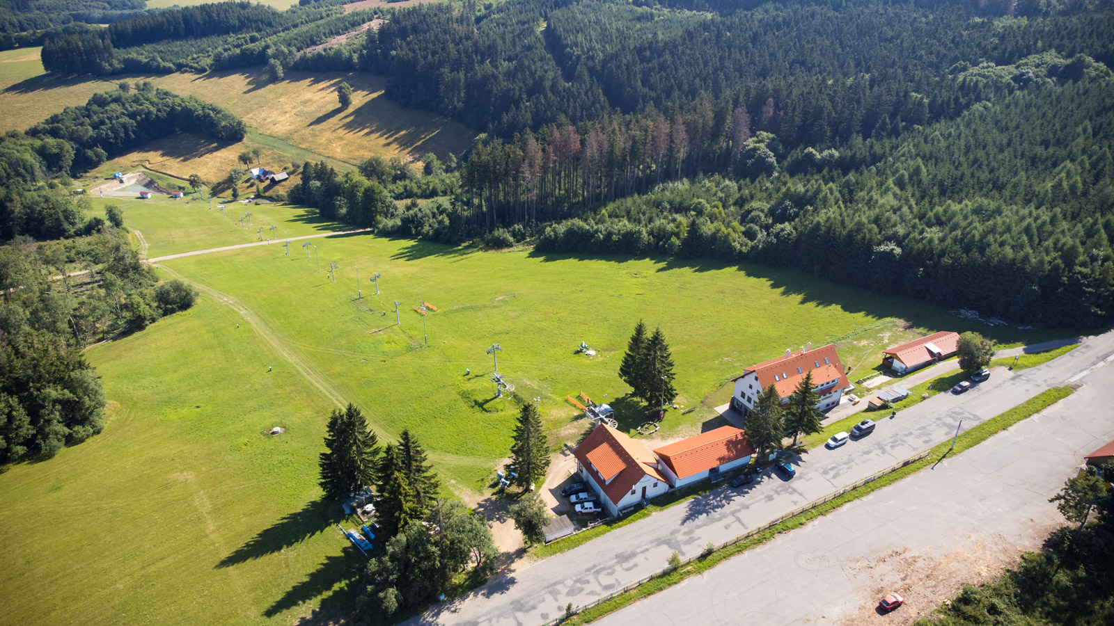 Bílé Karpaty – Mikulčin Vrch in Czech Republic - an aerial view of a house in the middle of a forest.