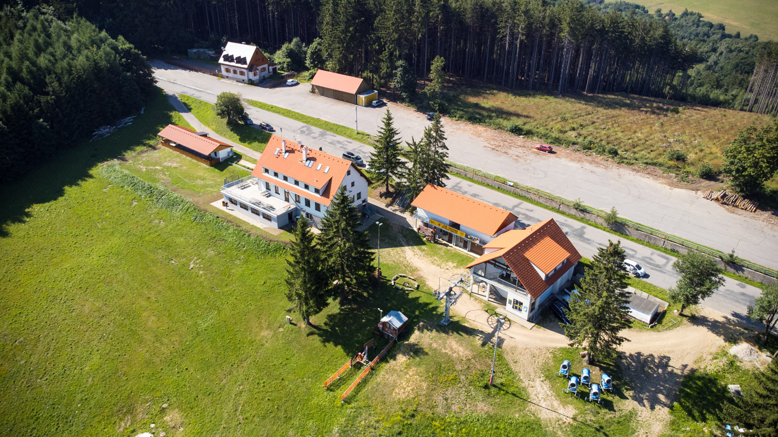 Bílé Karpaty – Mikulčin Vrch in Czech Republic - an aerial view of a house in the woods.