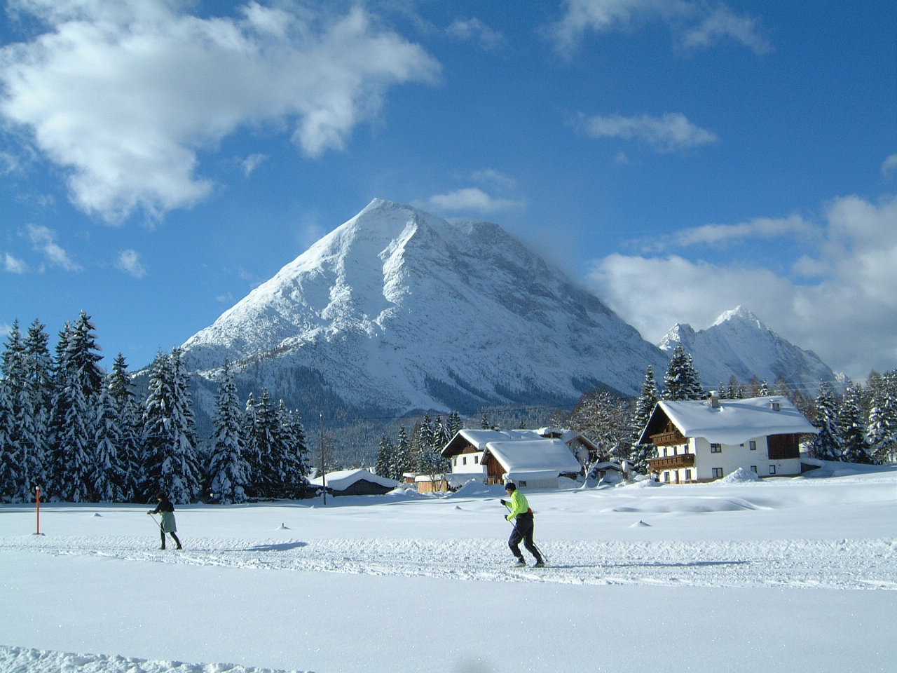 Neuleutasch in Austria - a group of people skiing in the snow.