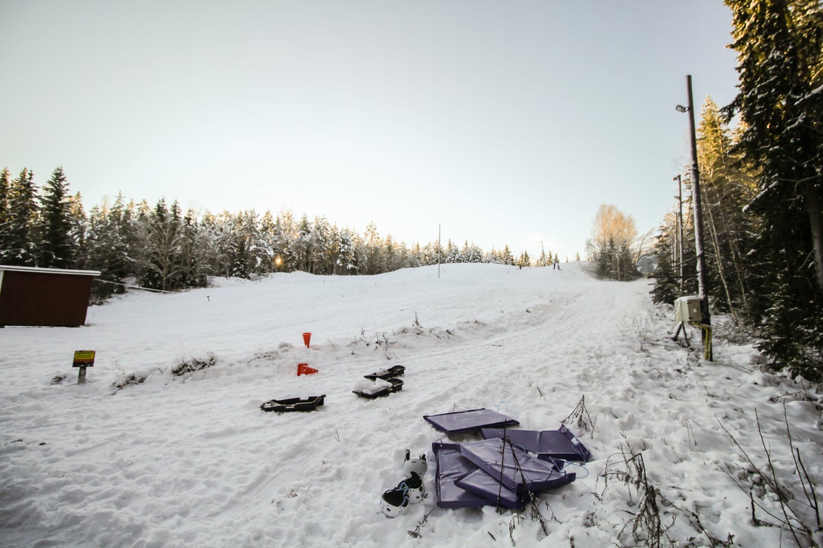 Skattmansöbacken in Sweden - a snowboard is laying on the ground in the snow.