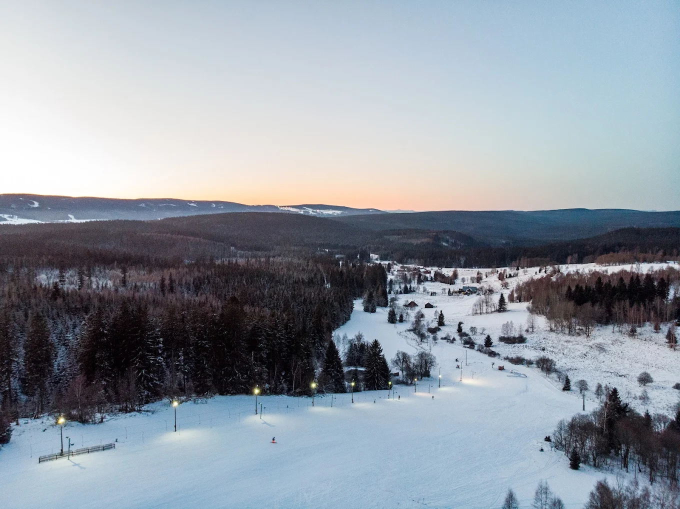 Osmelakowa Dolina – Spalona in Poland: an aerial view of a ski resort at sunset.