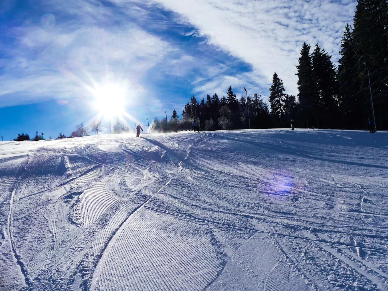 Osmelakowa Dolina – Spalona in Poland - a person skiing down a snow covered slope.