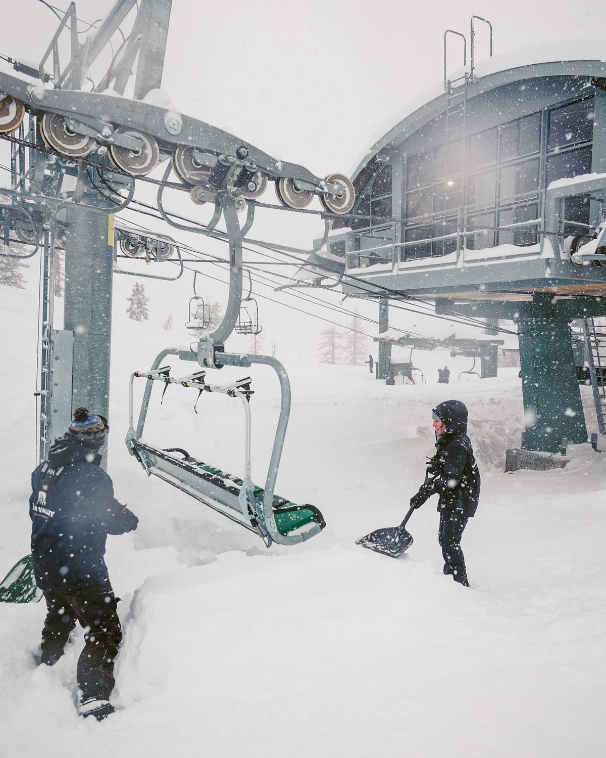 Bear Valley in USA - a couple of people that are standing in the snow.