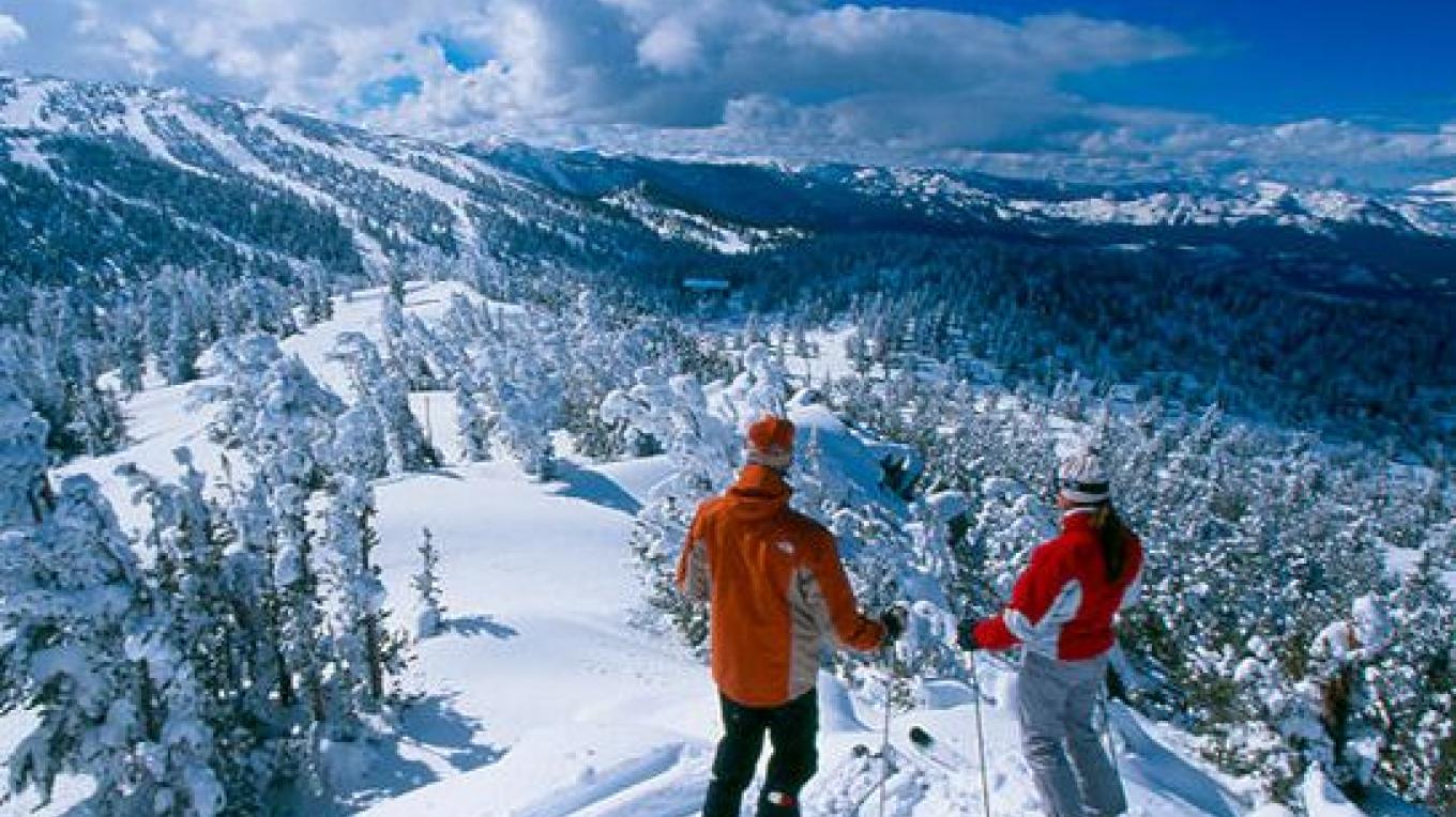 Bear Valley in USA - two skiers on a snowy mountain.