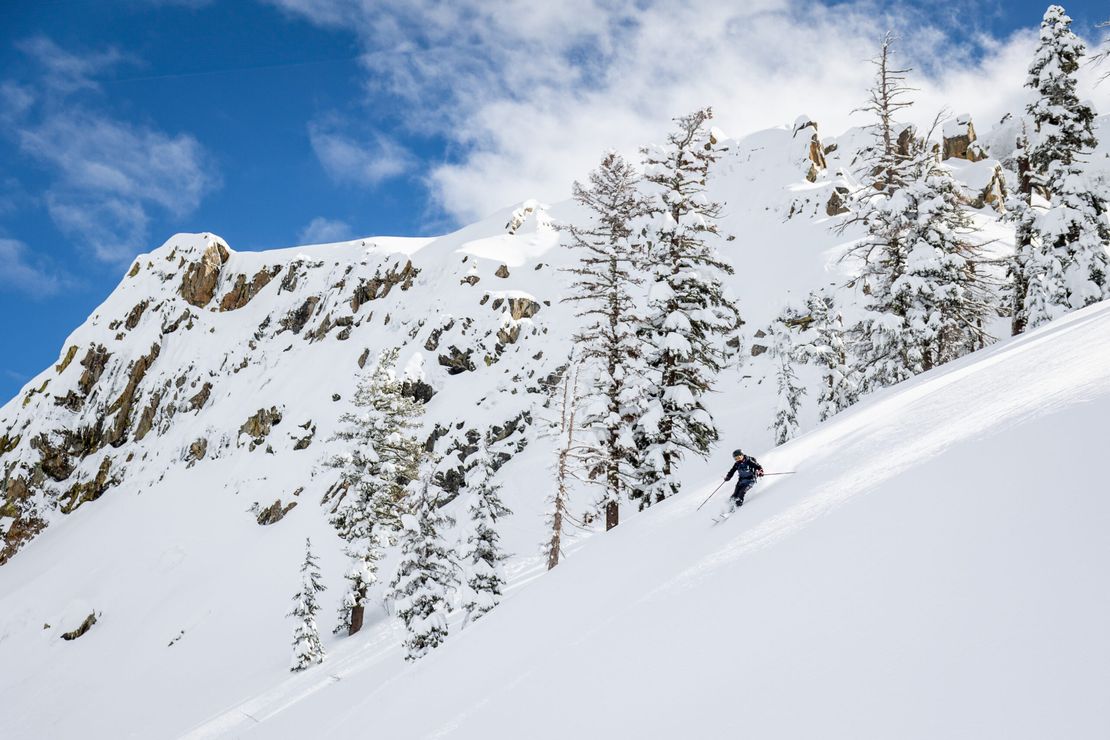 Bear Valley in USA - a person skiing down a snow covered mountain.