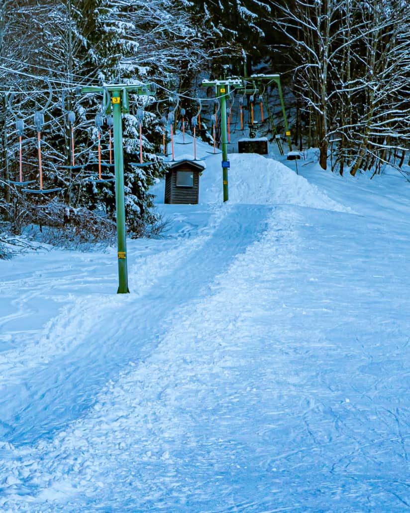 Pfannilift – Neuhaus in Germany - a snow covered trail in the woods.