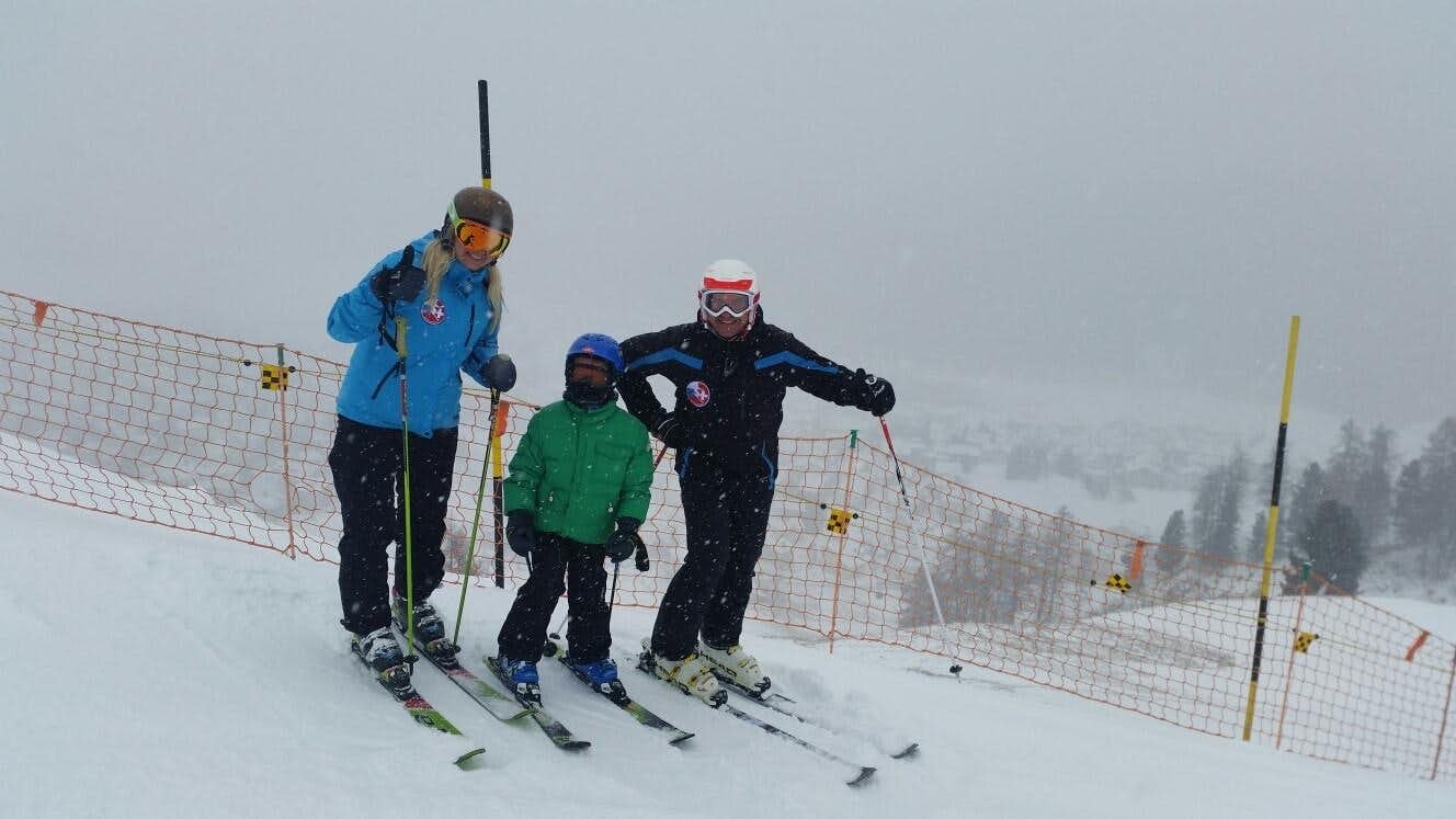 Beckenhalde – St Gallen in Switzerland - two people on skis in the snow.