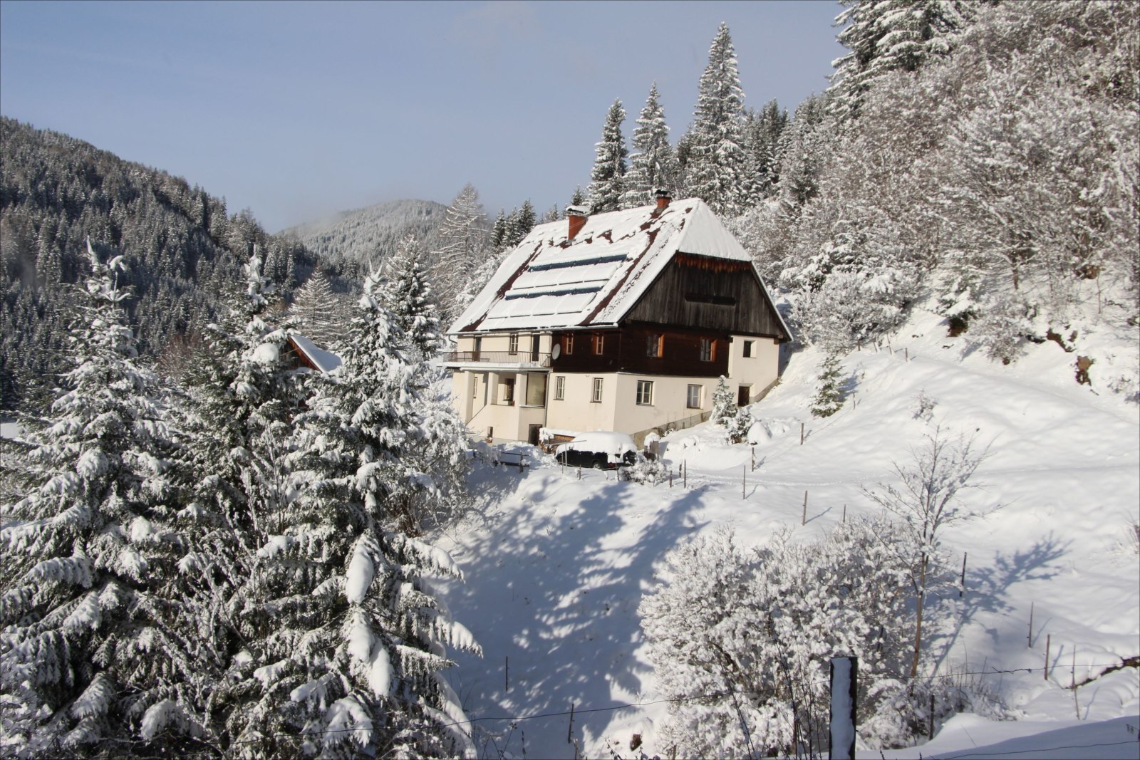 Pölstal in Austria - a small house in the middle of a snowy forest.