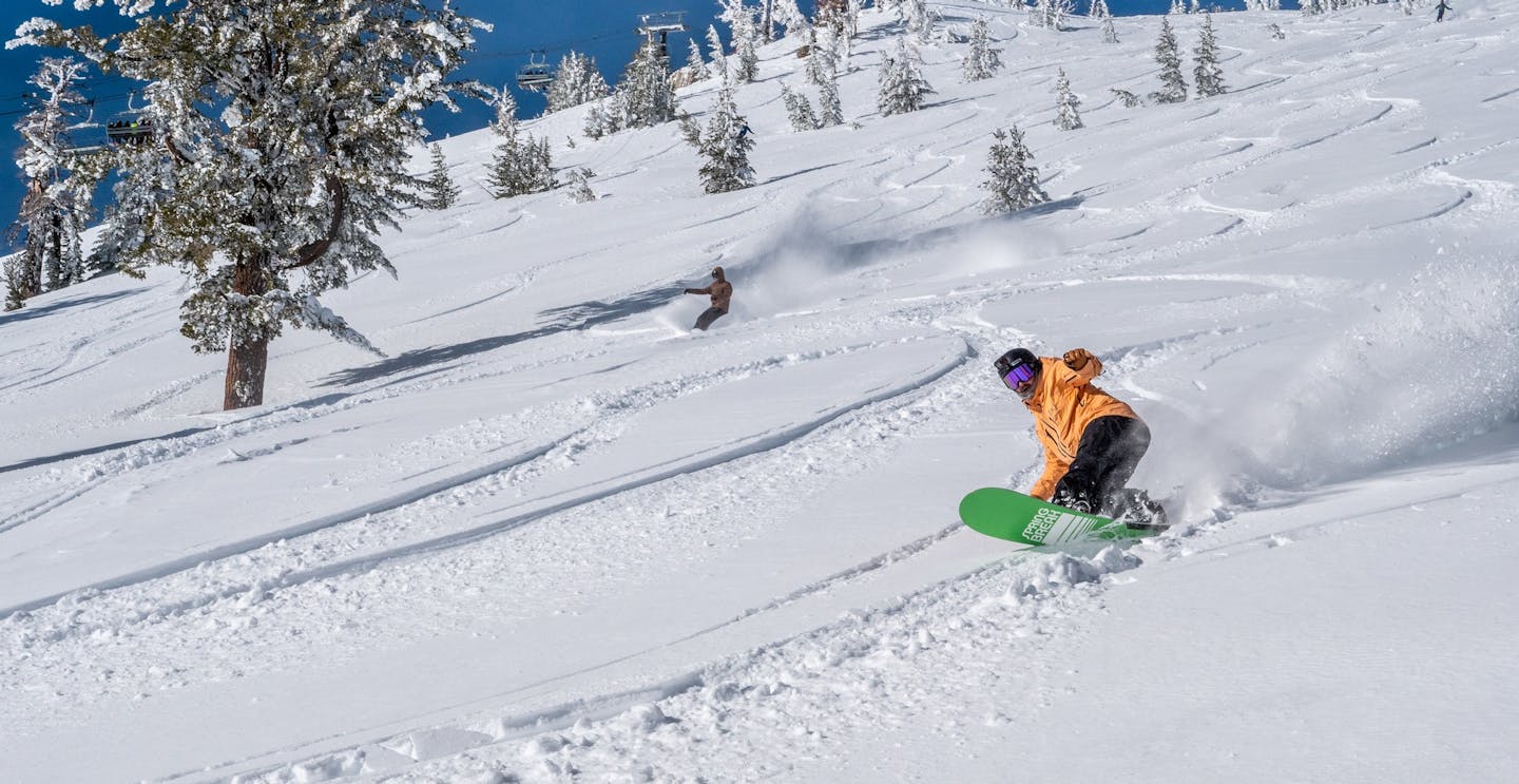 Mt Rose in USA - a person riding a snowboard down a snowy slope.