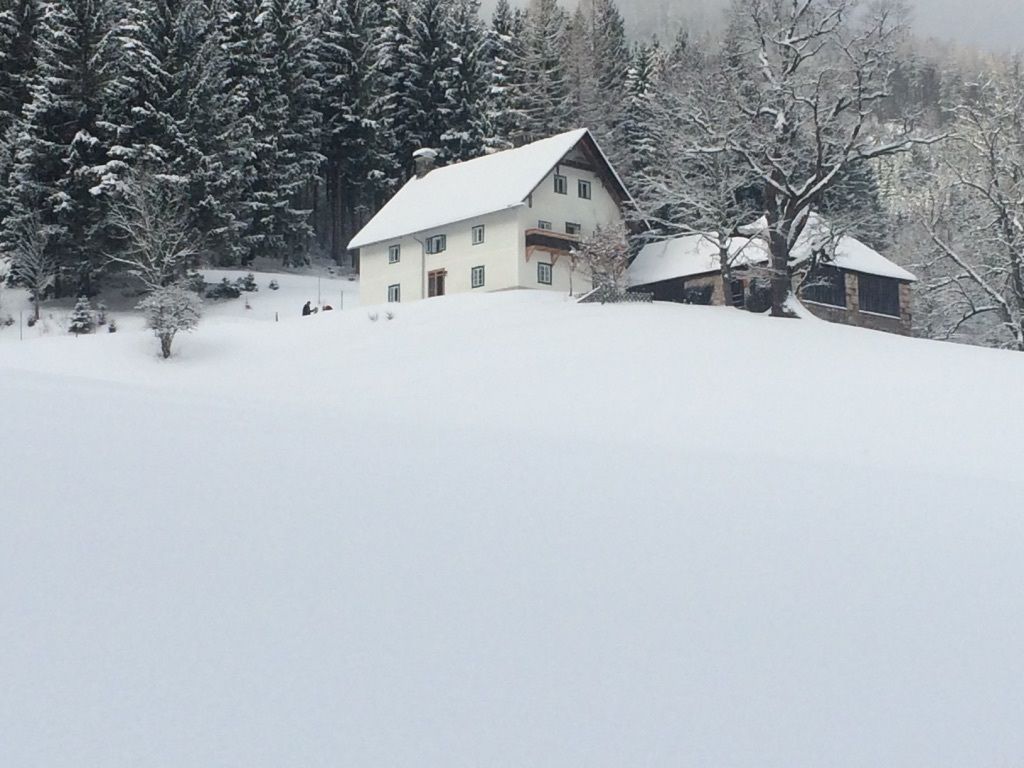 Eichfeldlift – Turnau in Austria - a house in the snow with trees in the background.
