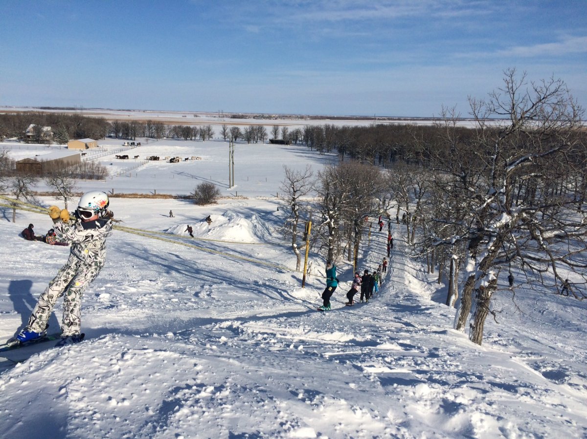 Stony Mountain in Canada - a group of people standing on top of snow covered ground.