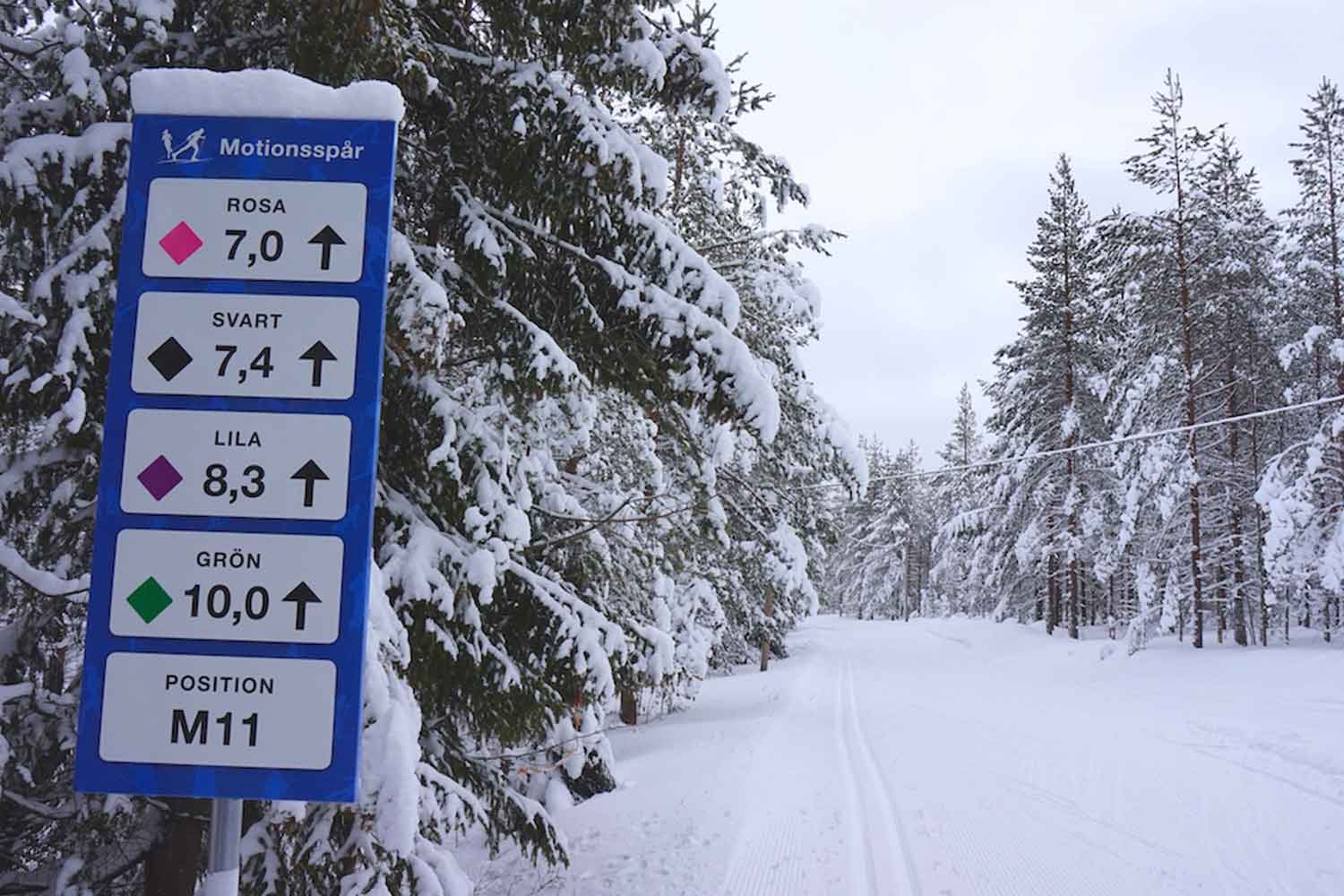 Ormberget – Luleå in Sweden - a sign on the side of a snowy road.