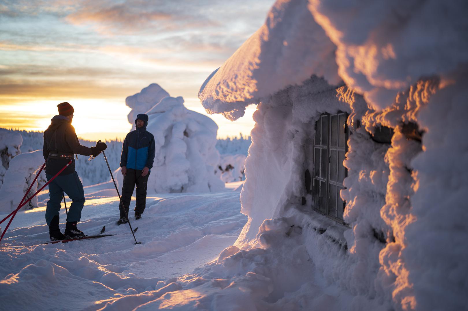 Ormberget – Luleå in Sweden - a couple of people that are standing in the snow.