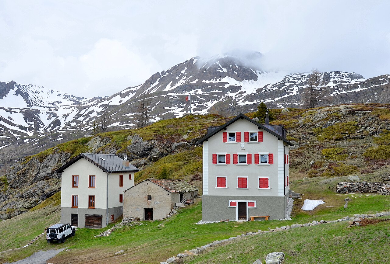 Realp in Switzerland - two houses on the side of a mountain.