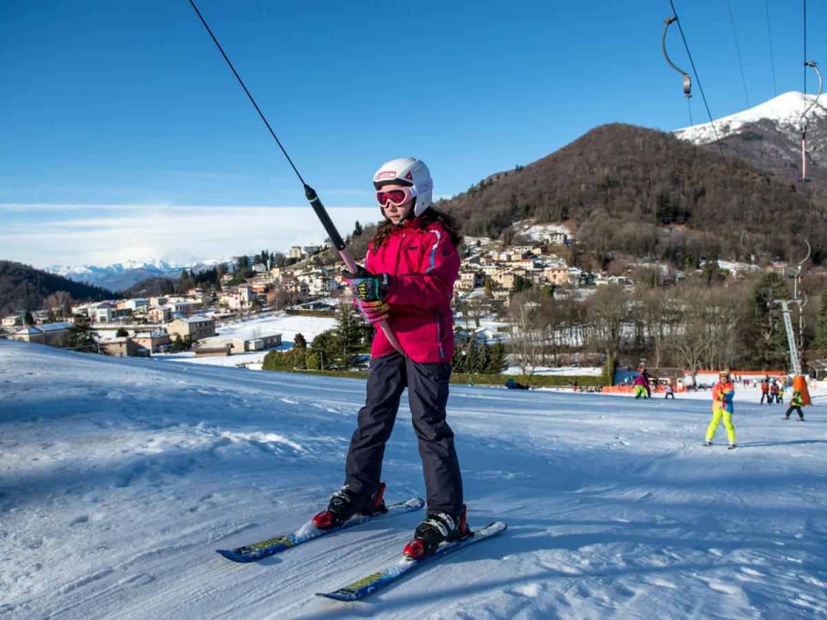 Bedea – Novaggio in Switzerland - a person on skis on a snowy slope.
