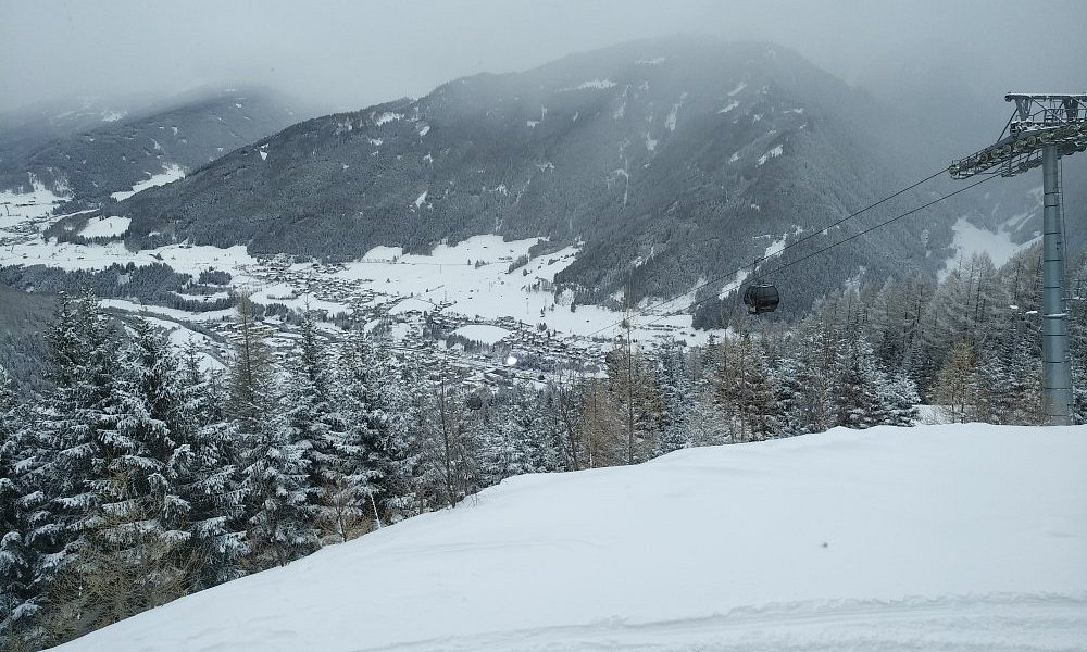 Arena Bergeralm in Austria - a ski lift going up a snowy mountain.