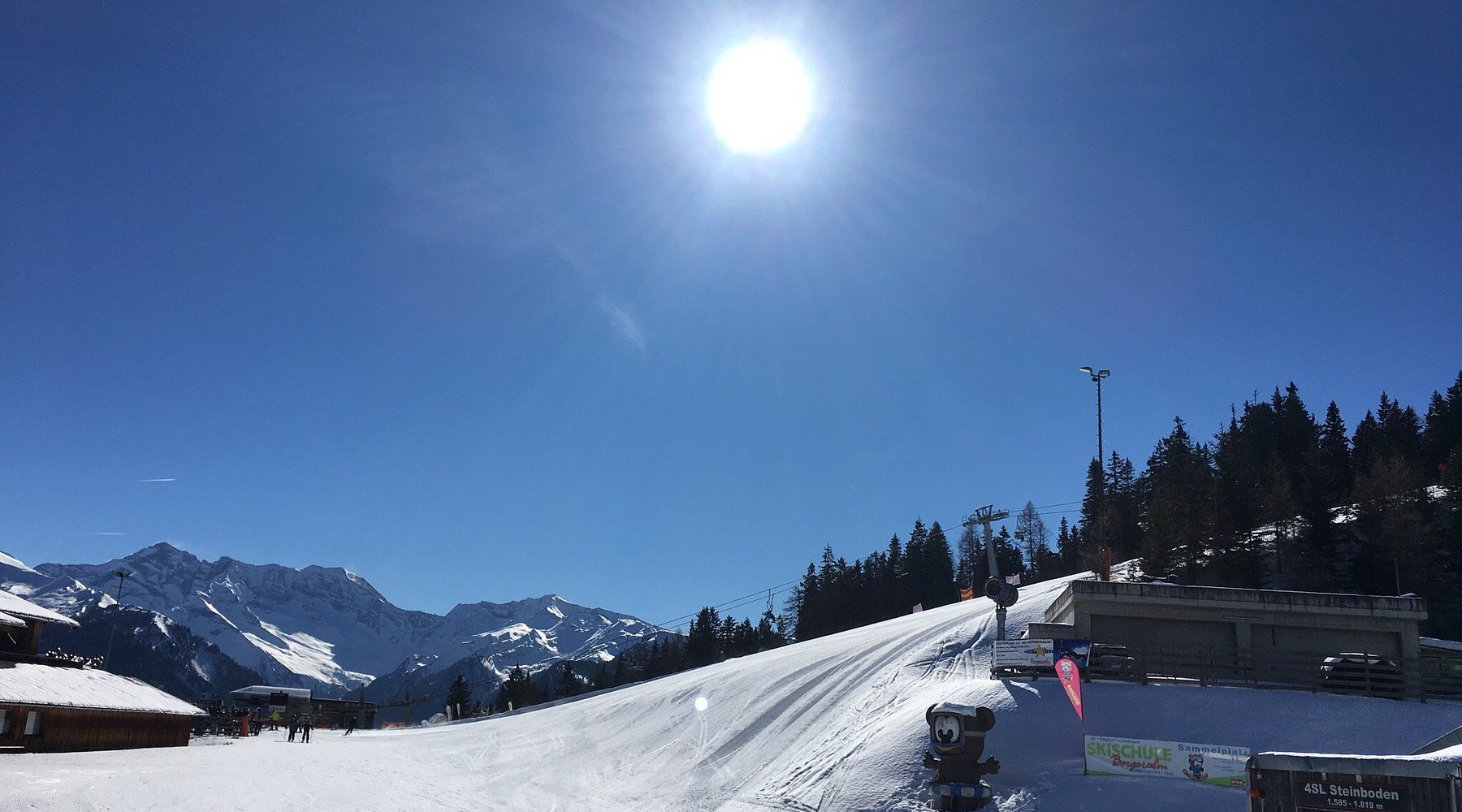 Arena Bergeralm in Austria - a person riding a snowboard down a snowy slope.