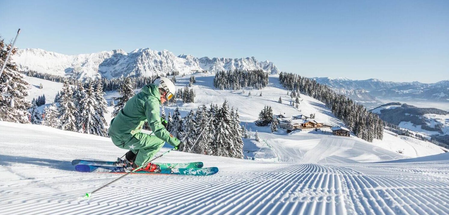 Arena Bergeralm in Austria - a person riding a snowboard down a snowy slope.