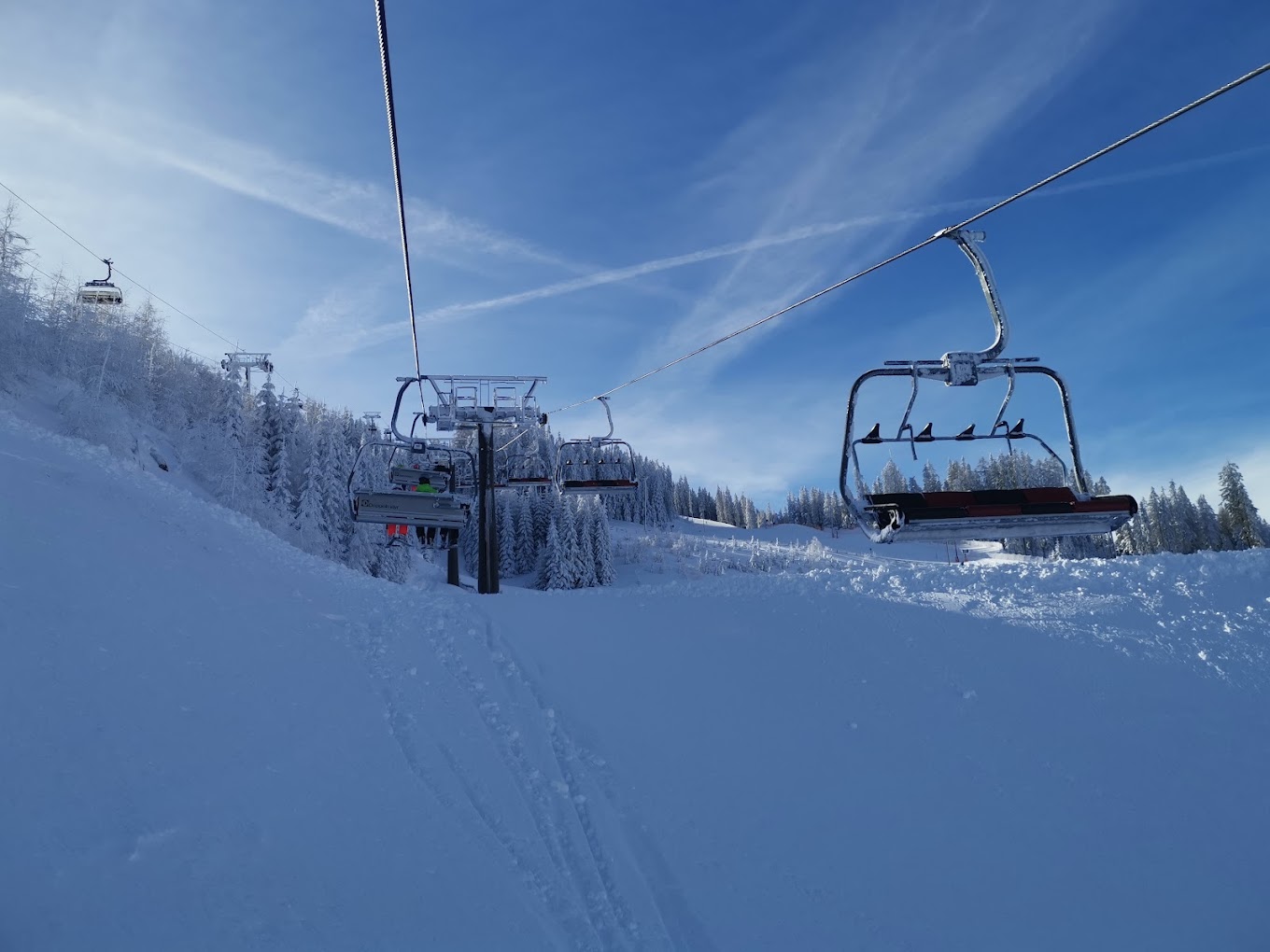 Arena Bergeralm in Austria - a ski lift going up a snowy slope.