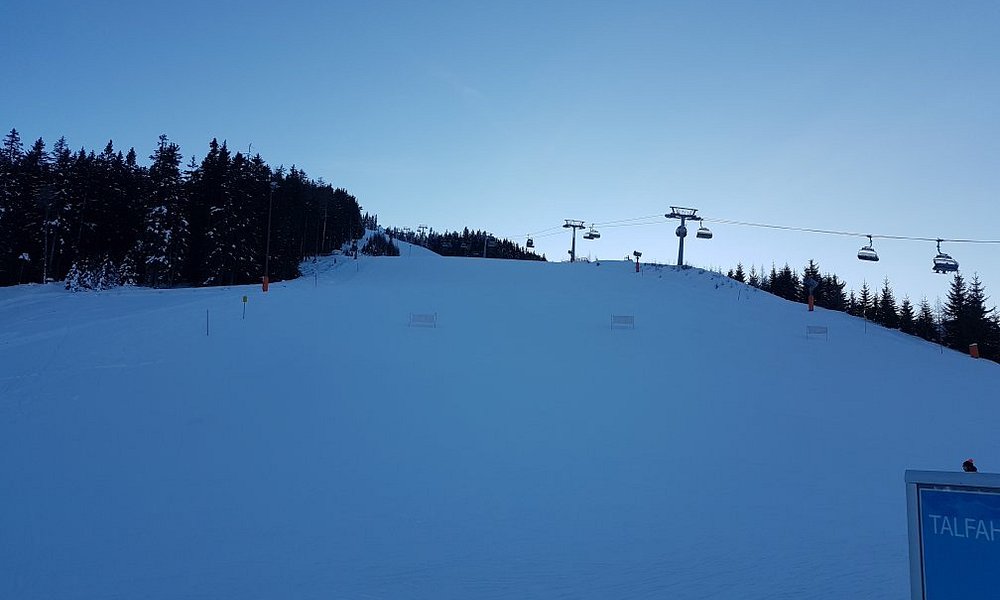 Arena Bergeralm in Austria - a ski slope with a ski lift in the background.