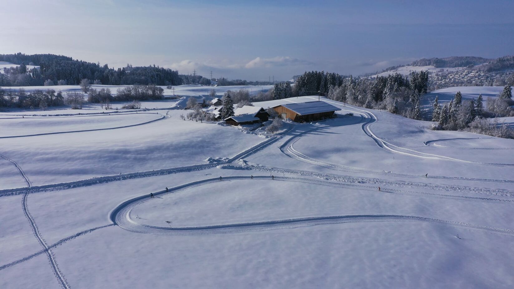 Bäretswil in Switzerland - a house in the middle of a snow covered field.