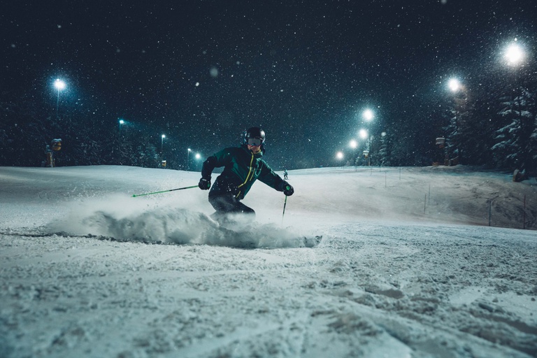 Jauerling – Maria Laach am Jauerling in Austria - a person skiing down a snowy slope at night.