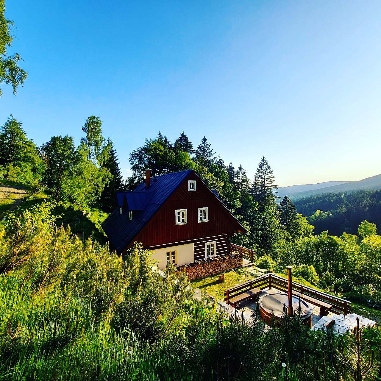 Pašák in Czech Republic - the house is surrounded by lush green trees.