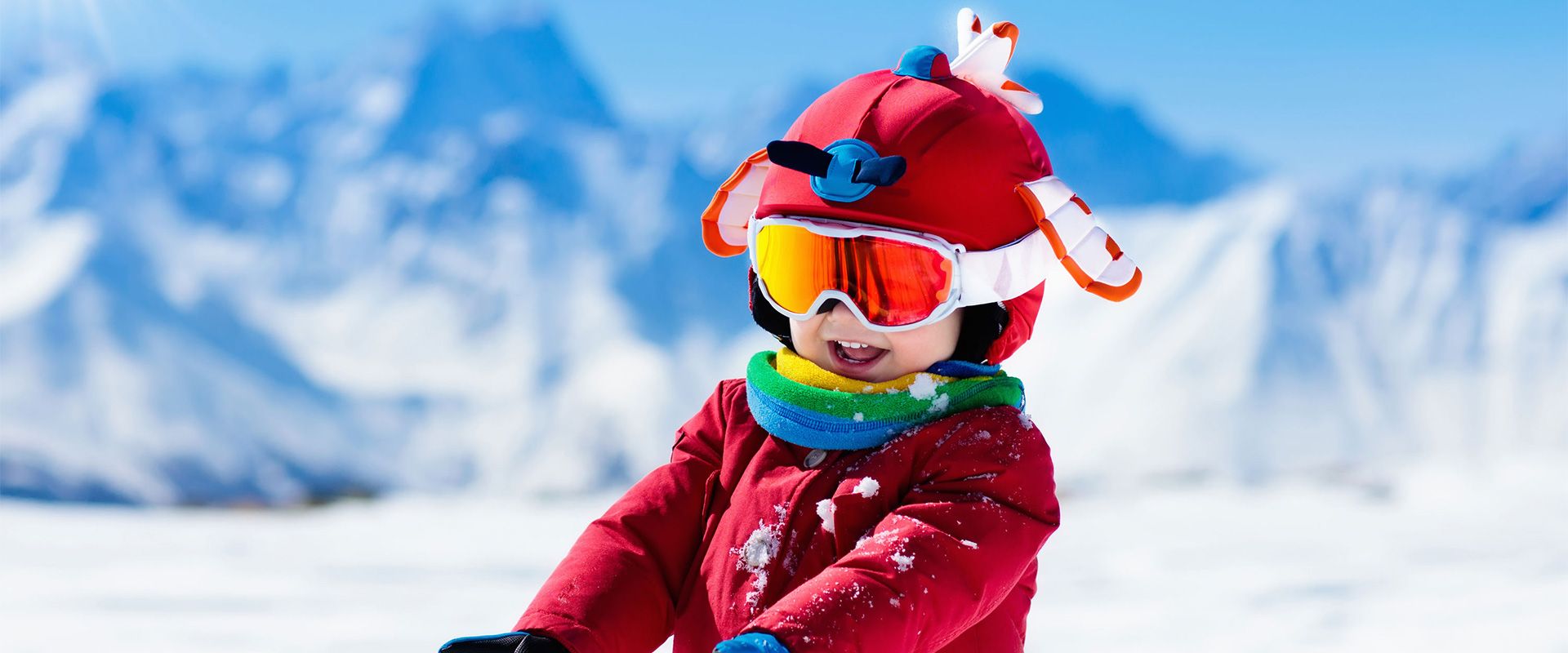 Amberglift – Walchsee in Austria - a little boy in a red jacket and goggles.