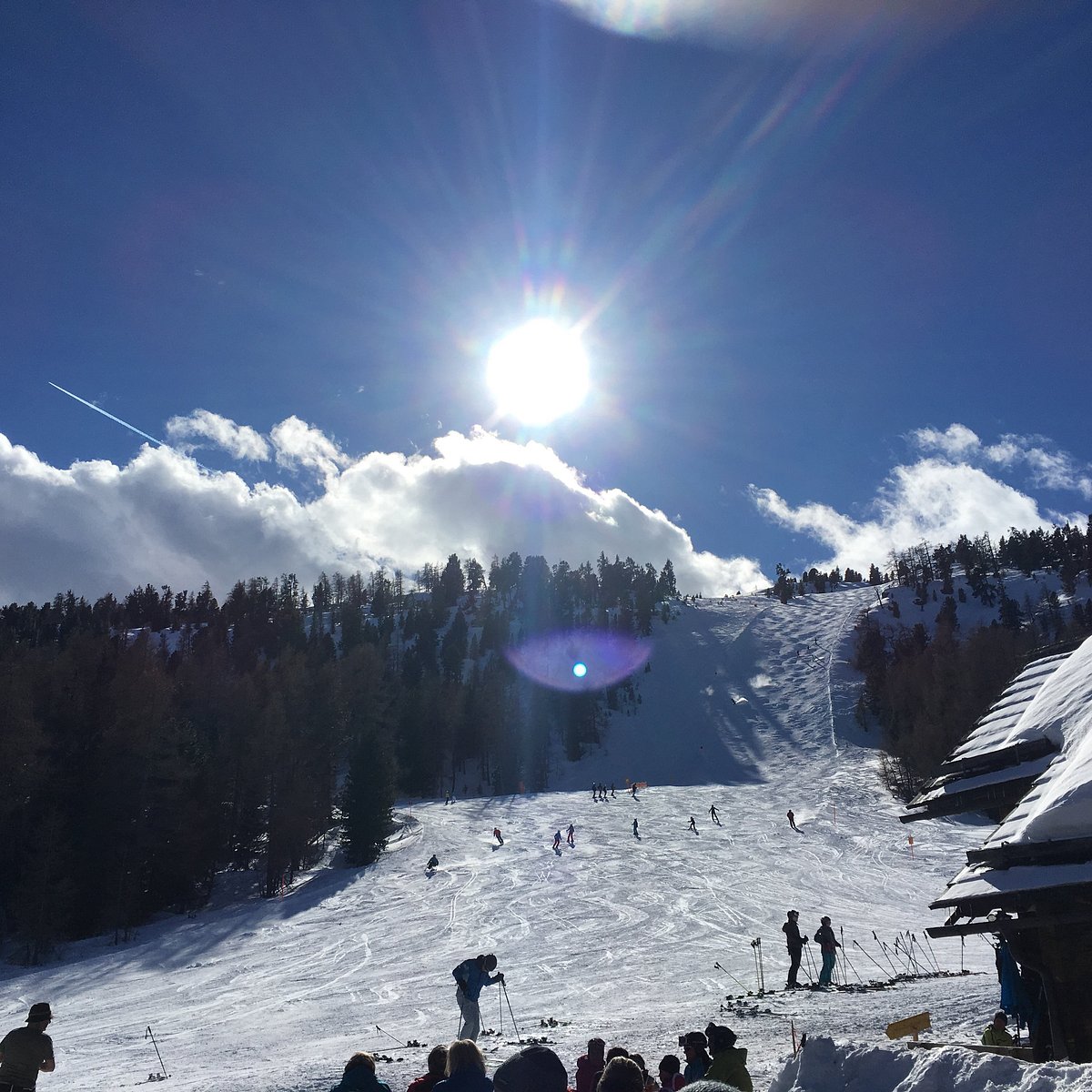 Fanningberg in Austria - a group of people skiing down a snowy slope.