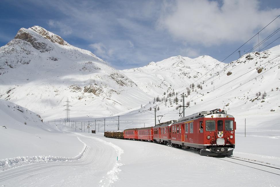 Oslo – Tryvann in Norway - a red train traveling through snow covered mountains.