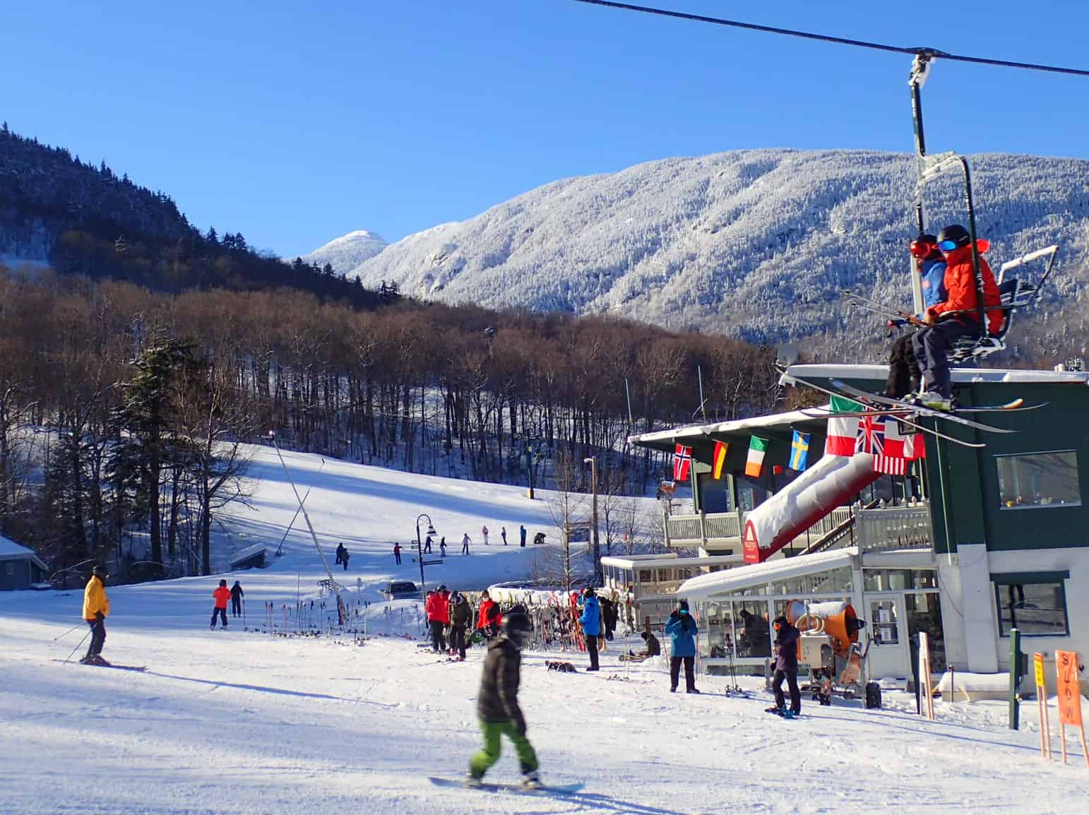 Smugglers' Notch Resort in USA - a group of people skiing down a snowy slope.