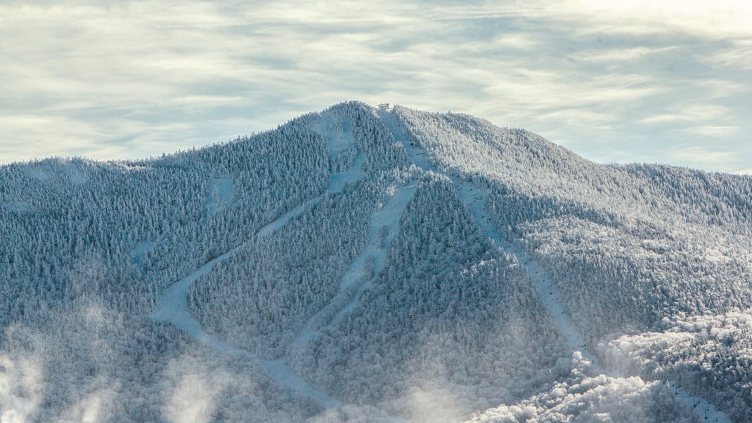 Smugglers' Notch Resort in USA - a snowy mountain covered in snow.