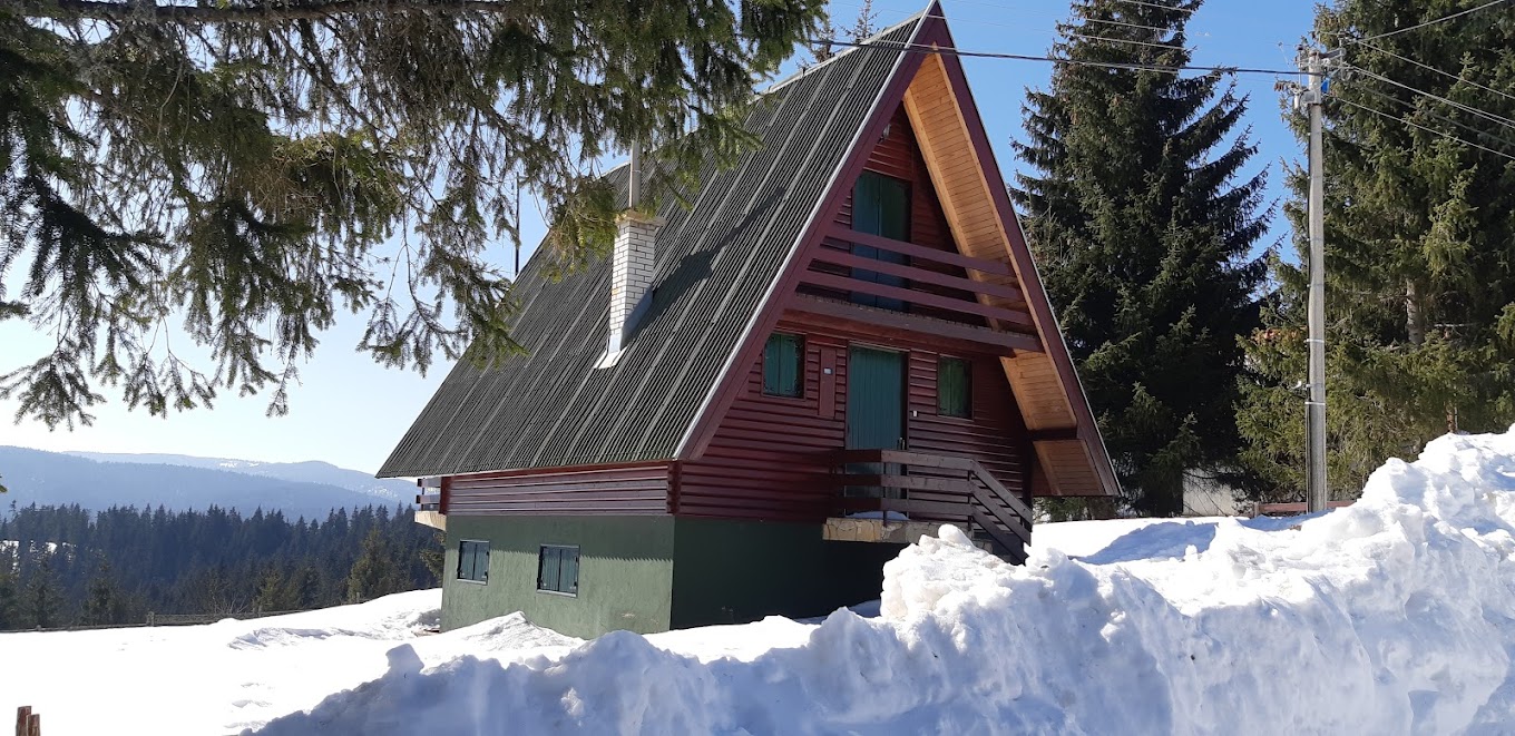 Ski slope Dajićima in Serbia - a small house in the middle of a pile of snow.