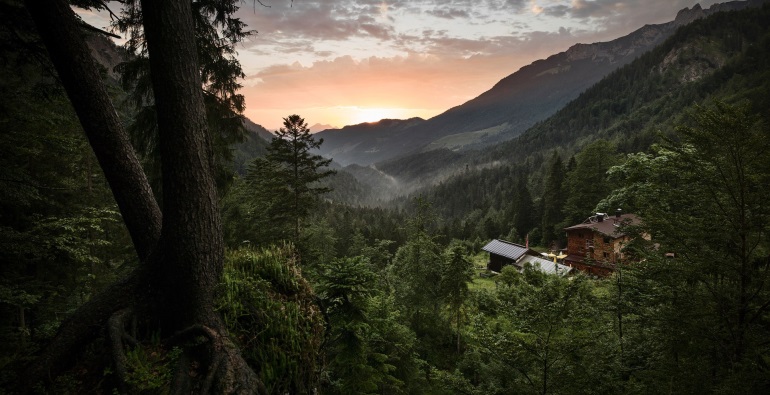 Kaiserlift – Kirchschlag bei Linz in Austria - a house in the middle of a forest at sunset.