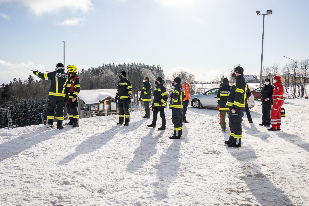 Kaiserlift – Kirchschlag bei Linz in Austria - a group of firefighters standing in the snow.