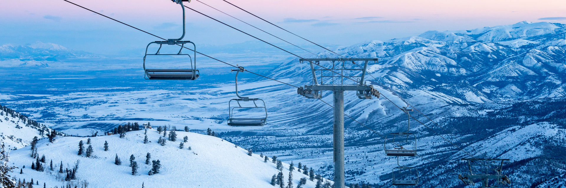 Powder Mountain in USA - a ski lift going up a snowy mountain.