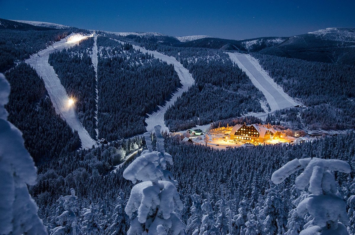 Kladenka in Czech Republic: a ski resort at night with snow on the ground.