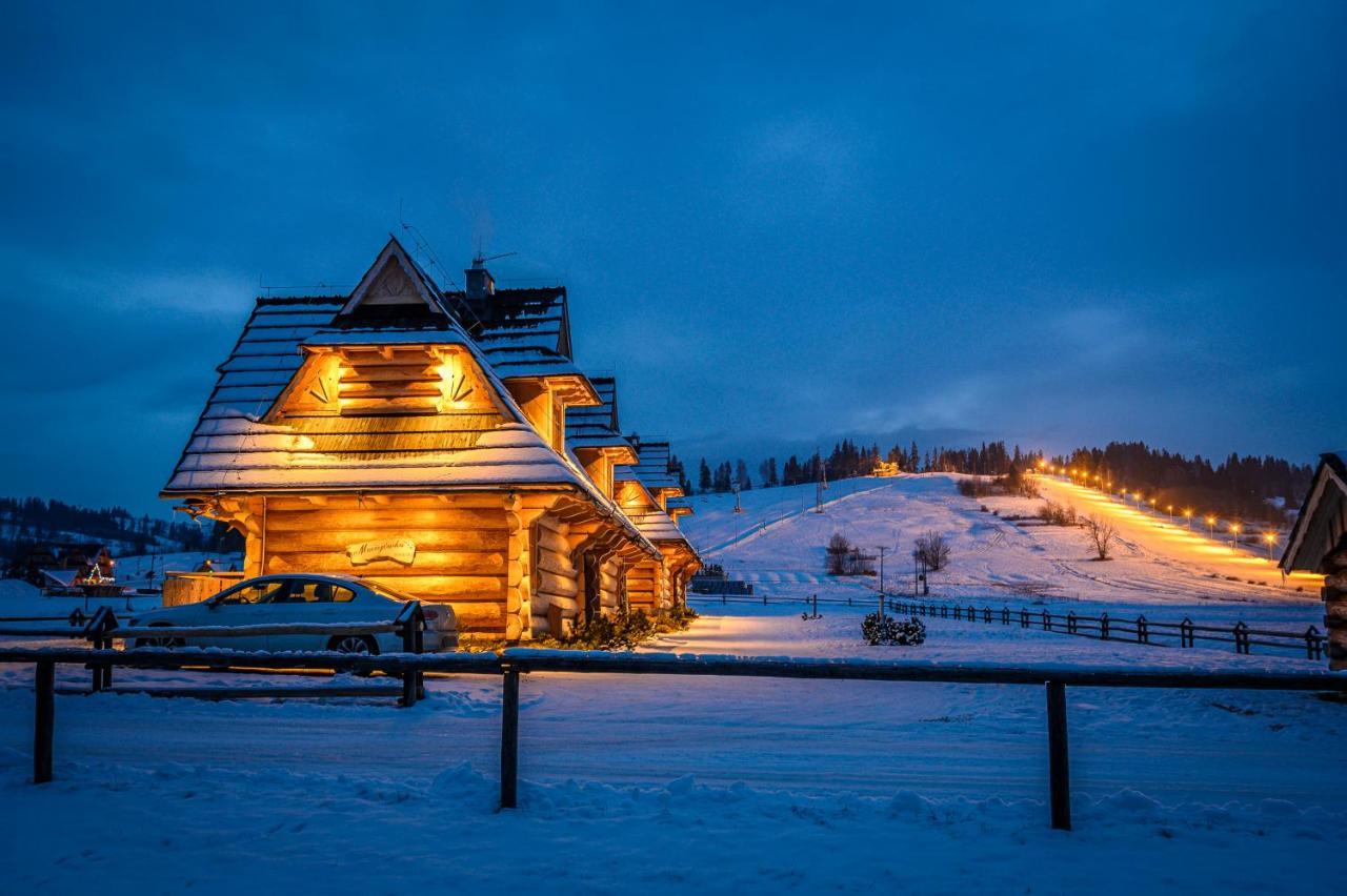 Przy Kolibie in Poland - a house in the snow at night.