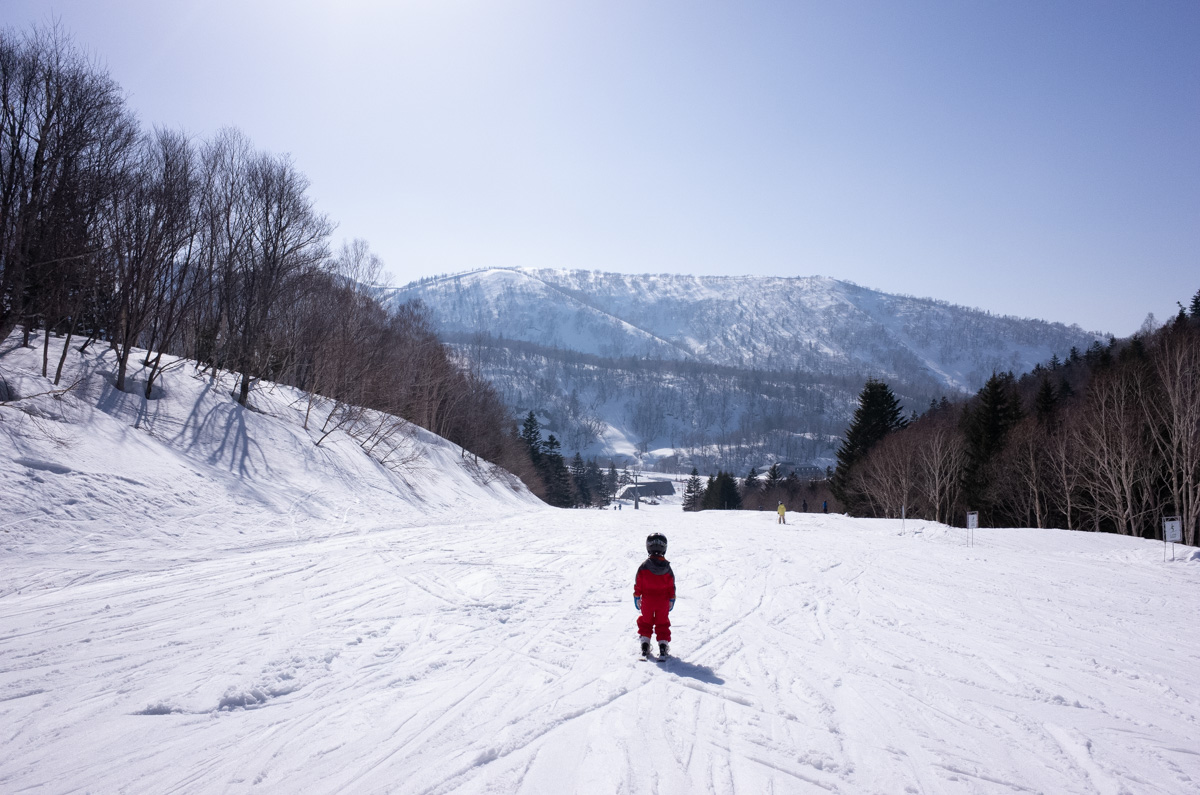 Kiroro in Japan - a person on a snowboard in the snow.